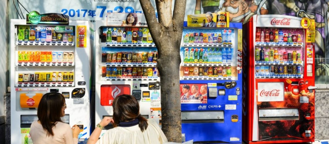 Tokyo Japan - April 4, 2018 : Akihabara neighborhood, Unidentified Japanese women are sitting and talking in front of vending machine. it is one of the most popular and popular Japanese capital.